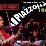 violinist and female dancers in long black dresses