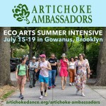 A group of people walking down an urban sidewalk in conversation