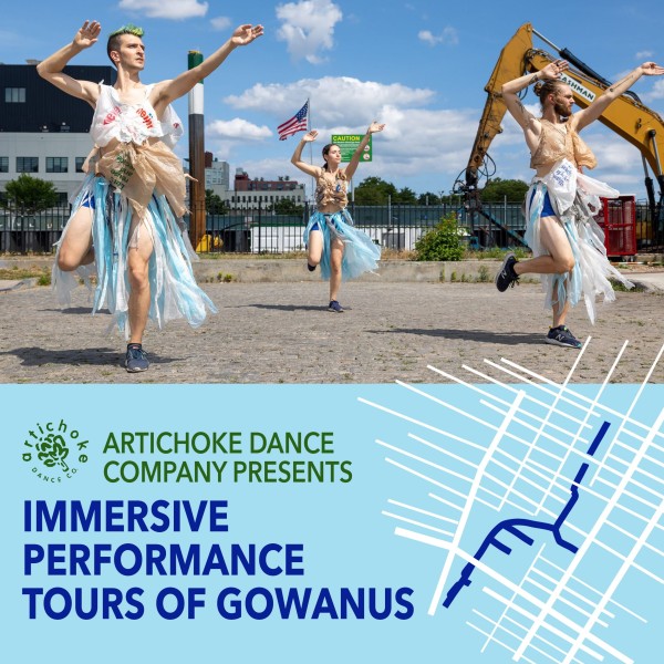 3 dancers wearing costume made of plastic bags dance in front of a large crane with their arms in the air.