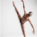 Dancer in a tilt arms reaching in opposite directions