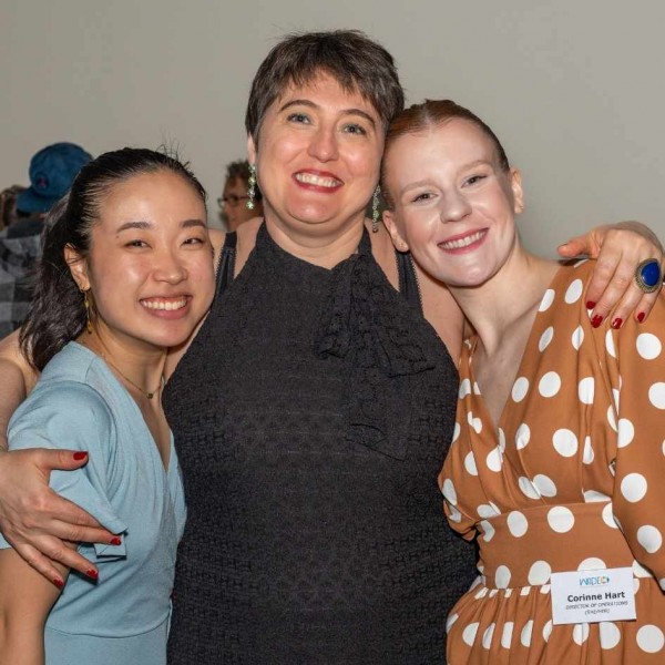 Rachel Ha-Eun Lee, Giada Matteini, and Corinne Hart with their arms around each other smiling.