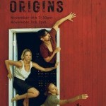 Three people emerge from a doorway of a red barn. They wear earthy and dark tones and reach outward with their limbs and eyes.