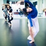 Woman is blue curved in modern dance position