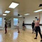 women tossing a hat in the air