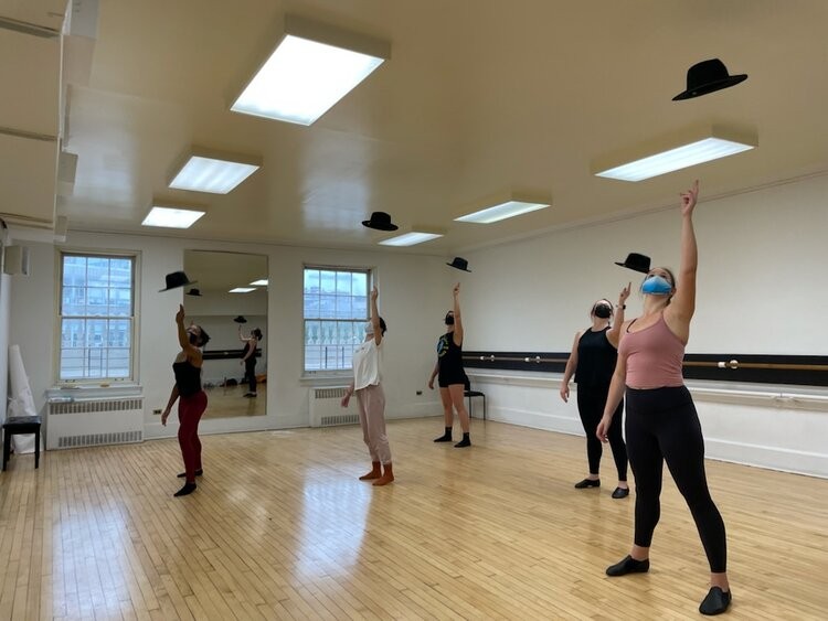 women tossing a hat in the air