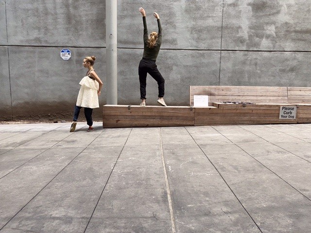 Two women step strangely