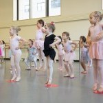 Children jump in the air during a New York City Ballet Workshop.