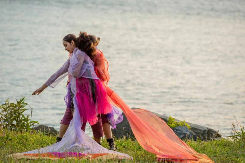 Company Dancers pictured in costume by a body of water