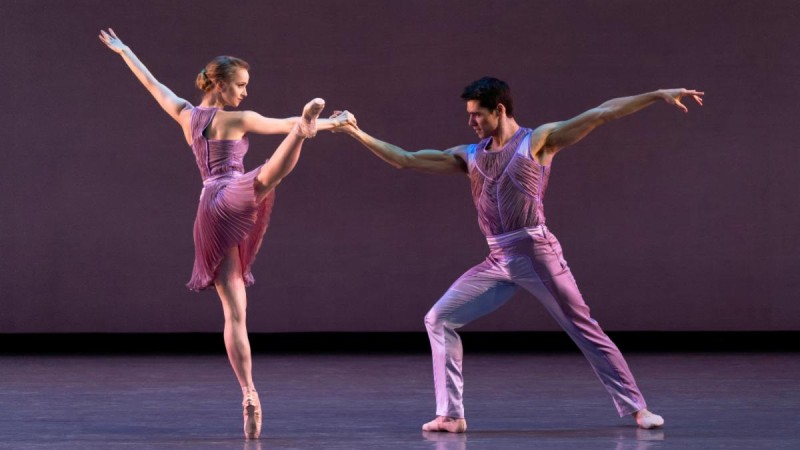 NYCB dancers performing in purple costumes on a stage