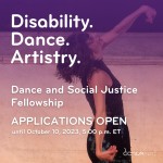 A photo of Elisabeth Motley: Elisabeth, a white woman with short brown hair throws their head back to their left. Wrists and arm