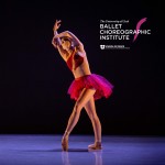 Dancer in red tutu with a black background