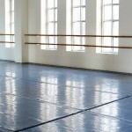 Inside view of the Armitage Gone! Dance studio where the residency will take place. Shows windows, slip resistant floor and bars