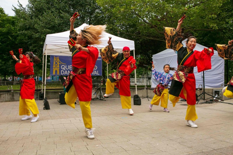 Photo taken at an outdoor Queensboro Dance Festival Event showcasing dancers/celebrating culture