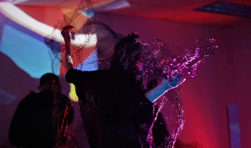 Solo Dancer Entwined with Mesh Fabric