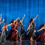 a diverse group of pre-teens in a lyrical contemporary dance with flowing burgundy and sage dresses