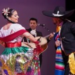 Two people dancing in traditional clothing.