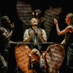 4 dancers dressed as angels encircle a central figure, a tenor, who looks longingly to the heavens