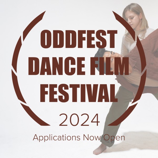 A dancer lifting another dancer by the waist