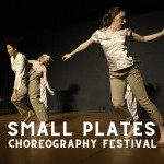 Three dancers in sepia tones in, one dancer in front turns off balance while two others run behind her.