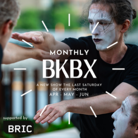 A New Show the Last Saturday of Every Month: A Mime in white makeup holding their arm out.