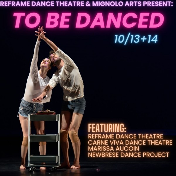 two dancers in front of a three-tier cart reach skyward, fingers intertwined.