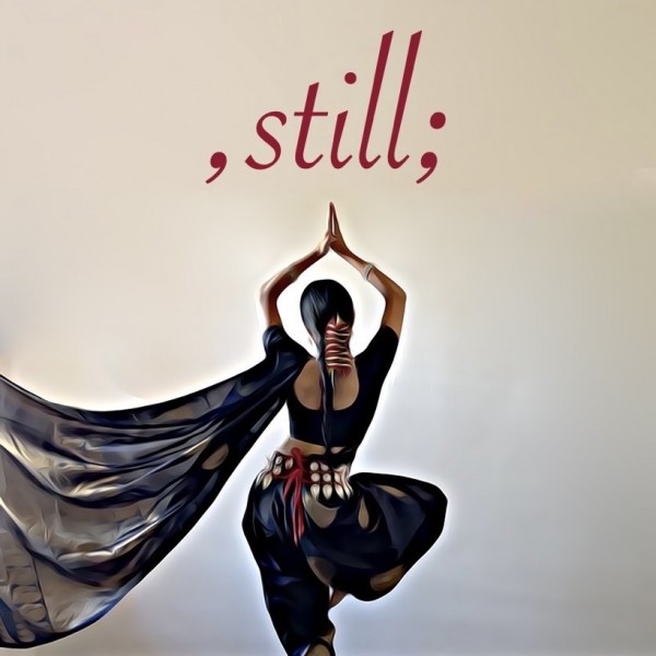 ,still; in red text above the image of an Indian Classical dancer wearing a black sari