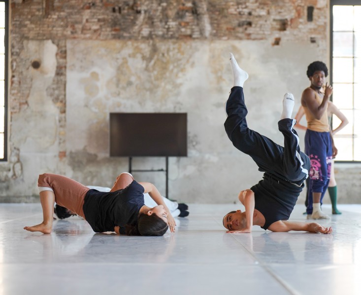 Three young dancers from Biennale College Danza 2023 are dancing