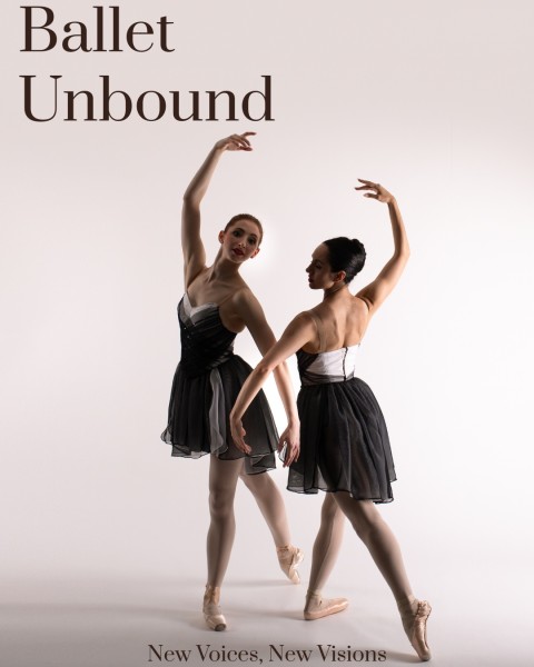 Two dancers pose in pointe shoes, arms are intertwined.