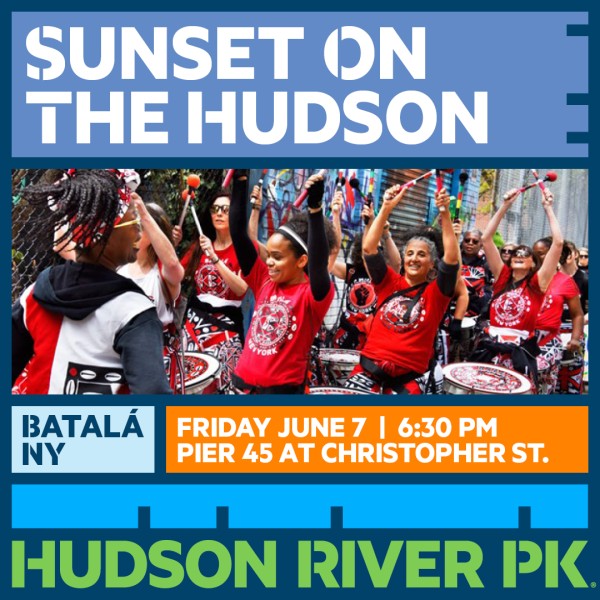 Batal&agrave; members drumming in a street fair.