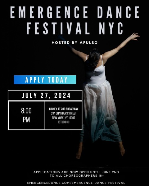 Woman in a white dress against a black backdrop. 