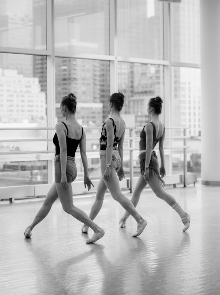 Dancers walking in a studio