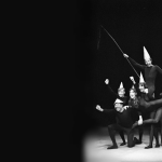 Photo of mimes gesturing out to crowd.