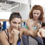 Two women participating in a fitness class