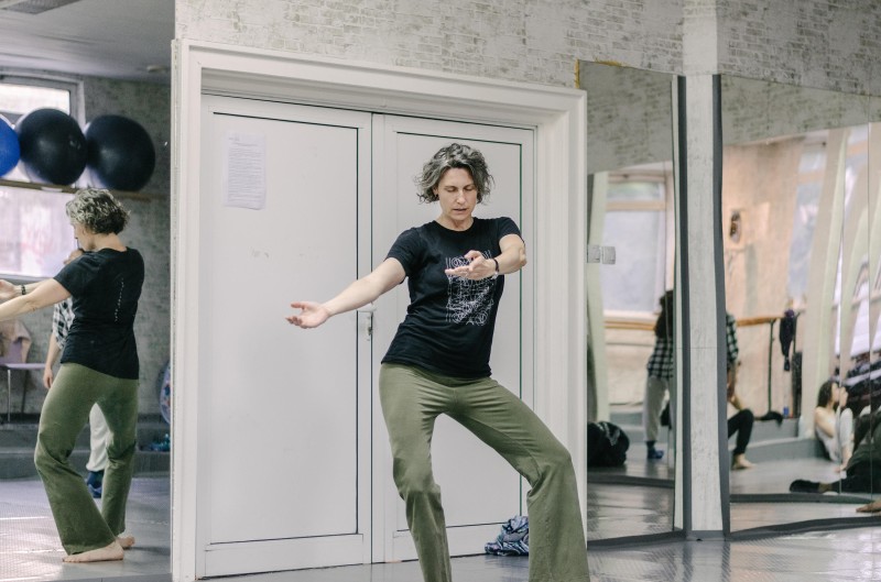 Megan Bridge eyes closed in a demi plié sitting in the right hip.