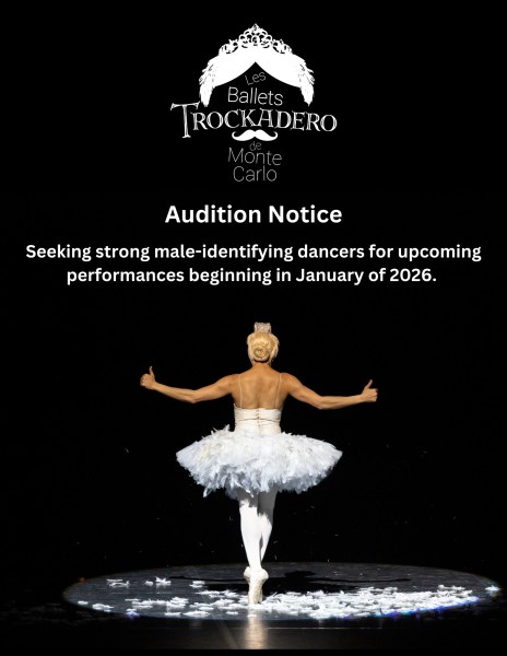 Dancer in a white tutu gives a thumbs up with text and Trocks logo above