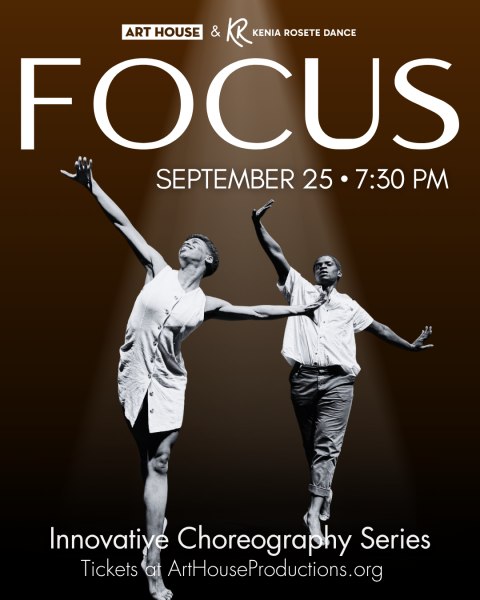 two dancers side-by-side looking up with their arms extended out