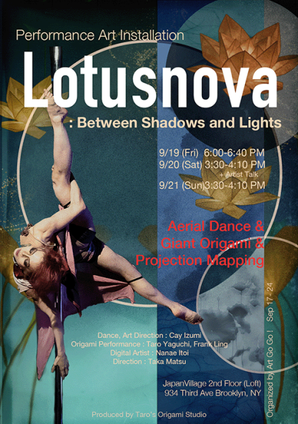 A contemporary dancer performing with origami lotus flowers on stage.