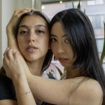 Pangea Dance Collective company dancers posing in the studio. 