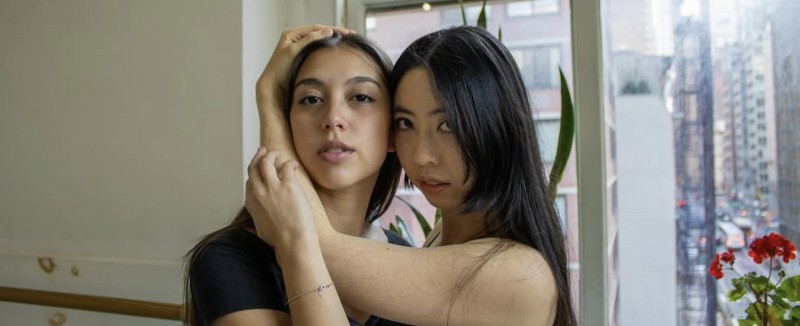 Pangea Dance Collective company dancers posing in the studio. 