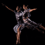 Two dancers, one male presenting and the other female presenting.   