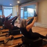 Pilates studio with Students on reformers