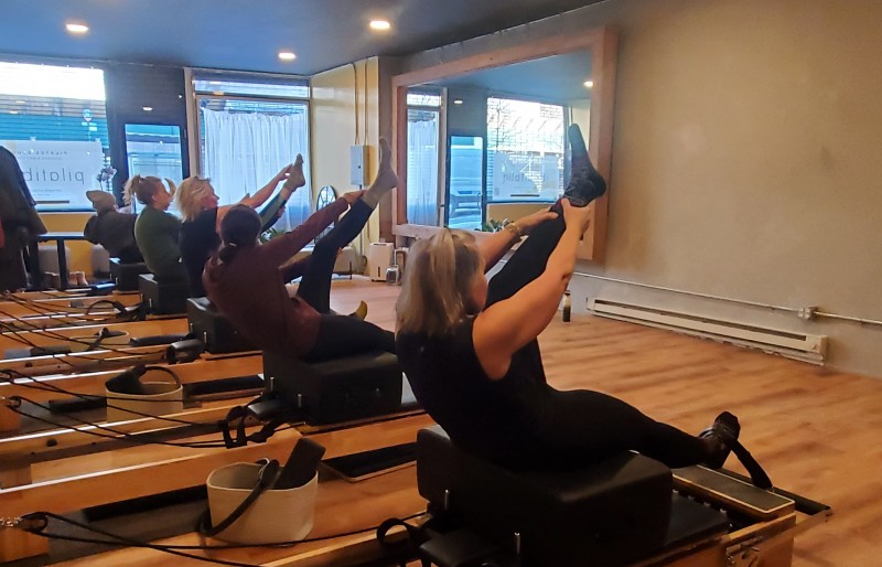 Pilates studio with Students on reformers