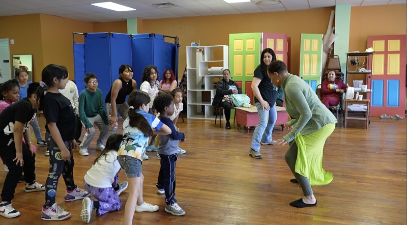 Dance teacher working with children