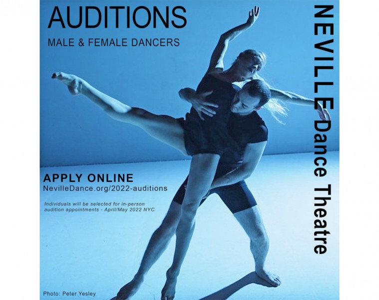 Male & female contemporary dancers together in front of a blue background