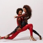 Partner Duet, Dancers w/ black hair, in red, black, gold costumes and heels