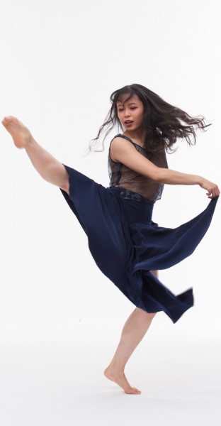 Woman dancing in a blue dress