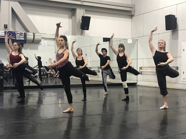 Group of dancers rehearsing in a studio