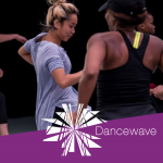 Dancers smiling behind the Dancewave Logo.