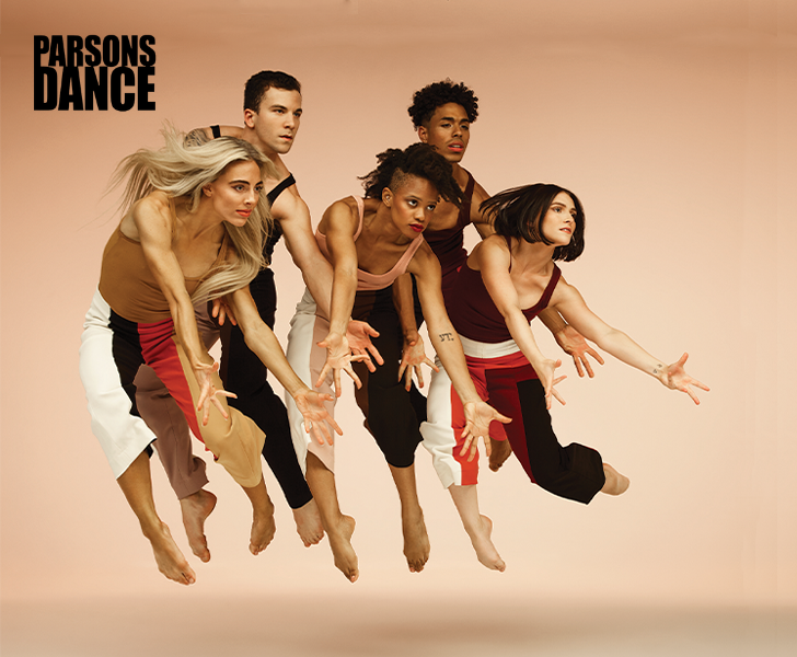 five dancers jumping in the air