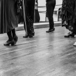 A view of flamenco dancers legs and feet during a class.